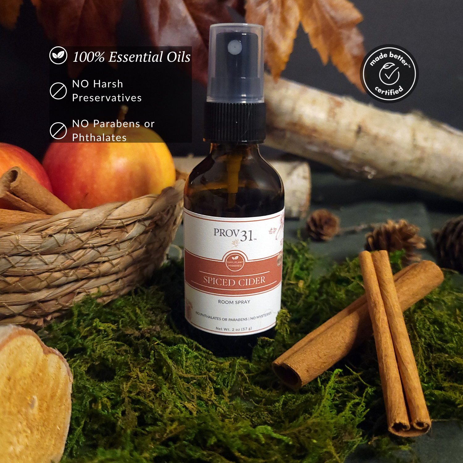 Bottle of Prov31 Spiced Cider room spray with autumn-themed background