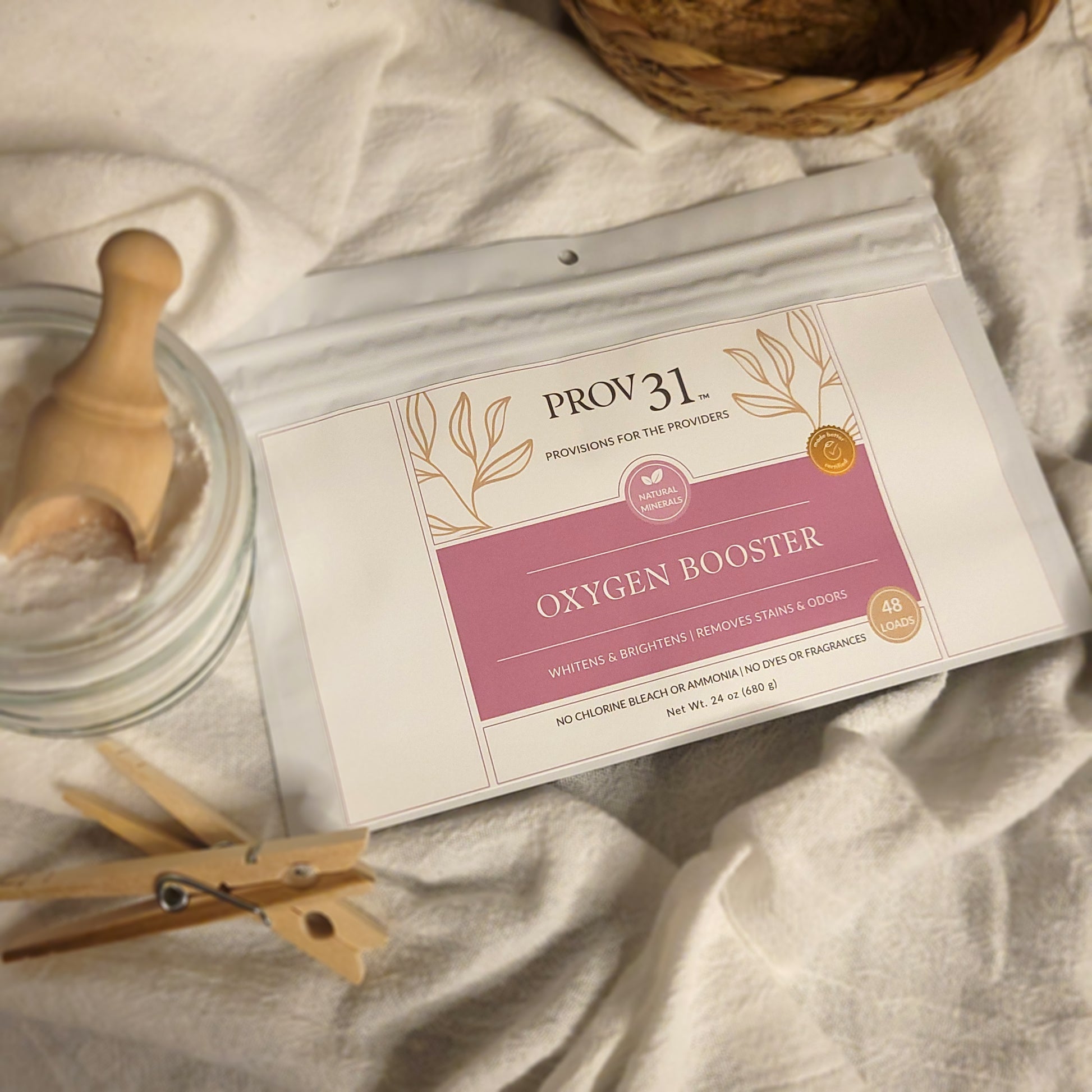 PROV 31 Oxygen Booster package on a linen surface with a wooden basket and jar.